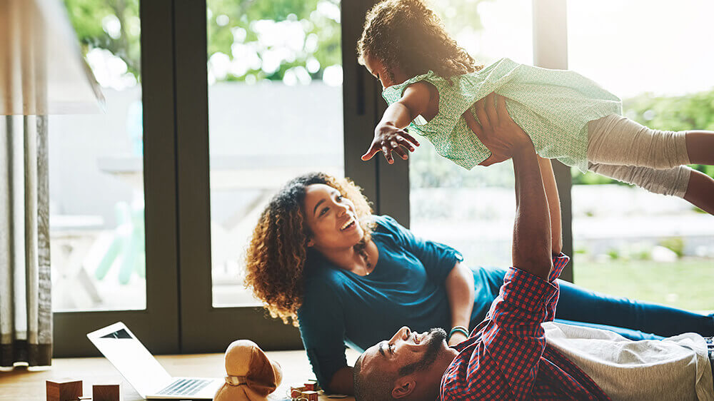 Family playing on living room floor